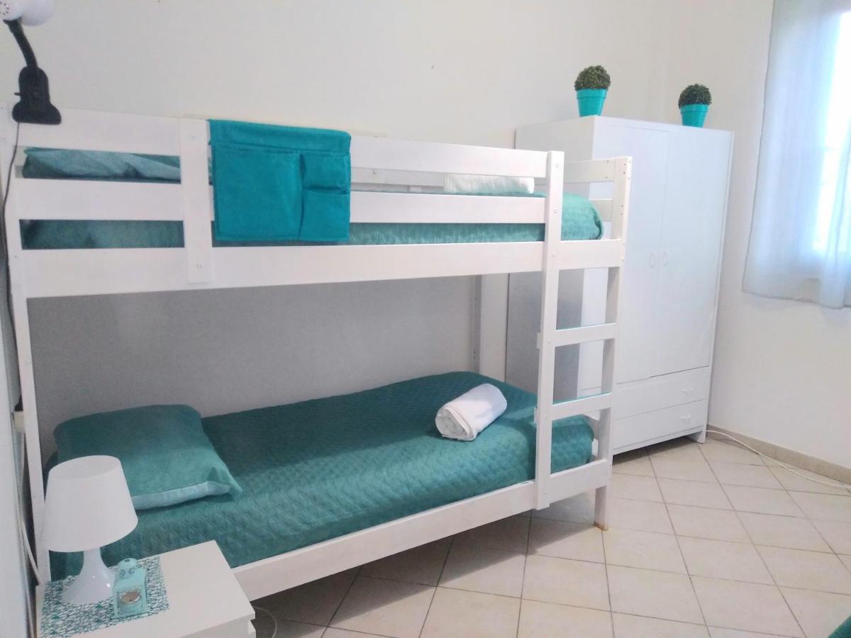 Casa Vacanze Oasis Home Portopino Porto Pino Exterior foto