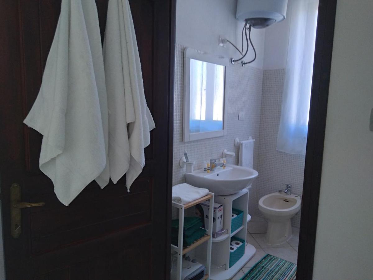 Casa Vacanze Oasis Home Portopino Porto Pino Exterior foto