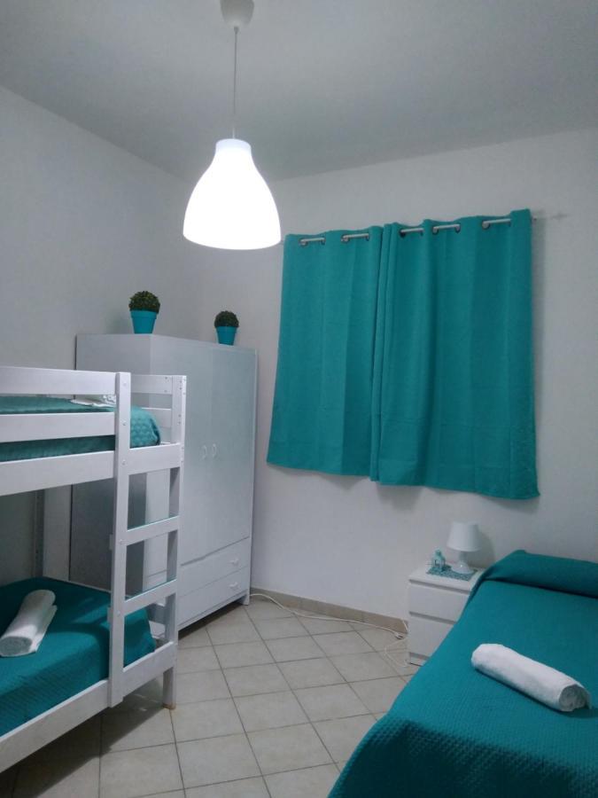 Casa Vacanze Oasis Home Portopino Porto Pino Exterior foto